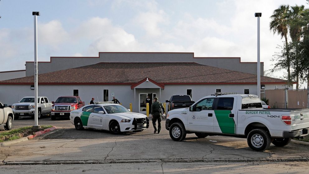 PHOTO: In this Saturday, June 23, 2018, file photo, a U.S. Border Patrol Agent walks between vehicles outside the Central Processing Center in McAllen, Texas