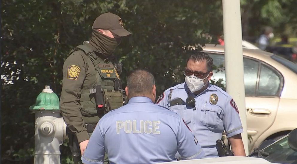 PHOTO: Law enforcement and Border Patrol officers respond to the scene where two McAllen, Texas, police officers were shot and killed responding to a home on Saturday, July 11, 2020.