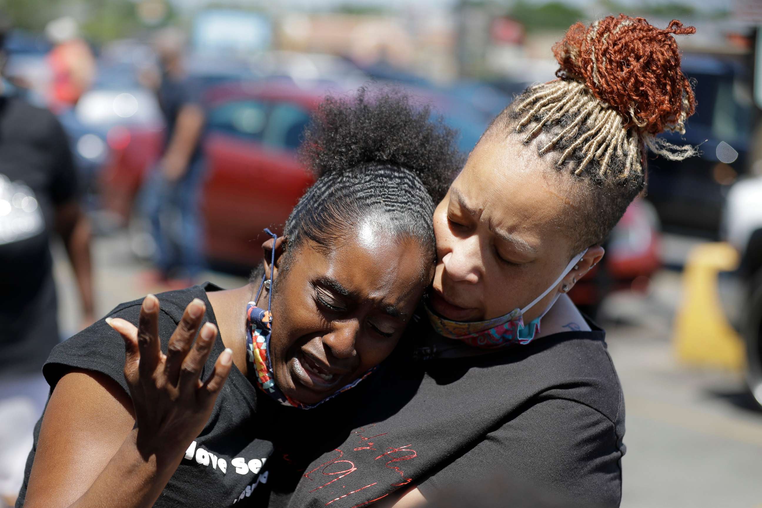 PHOTO: Two women pray, June 2, 2020, in Louisville, Ky., near the intersection where David McAtee was killed Sunday evening.