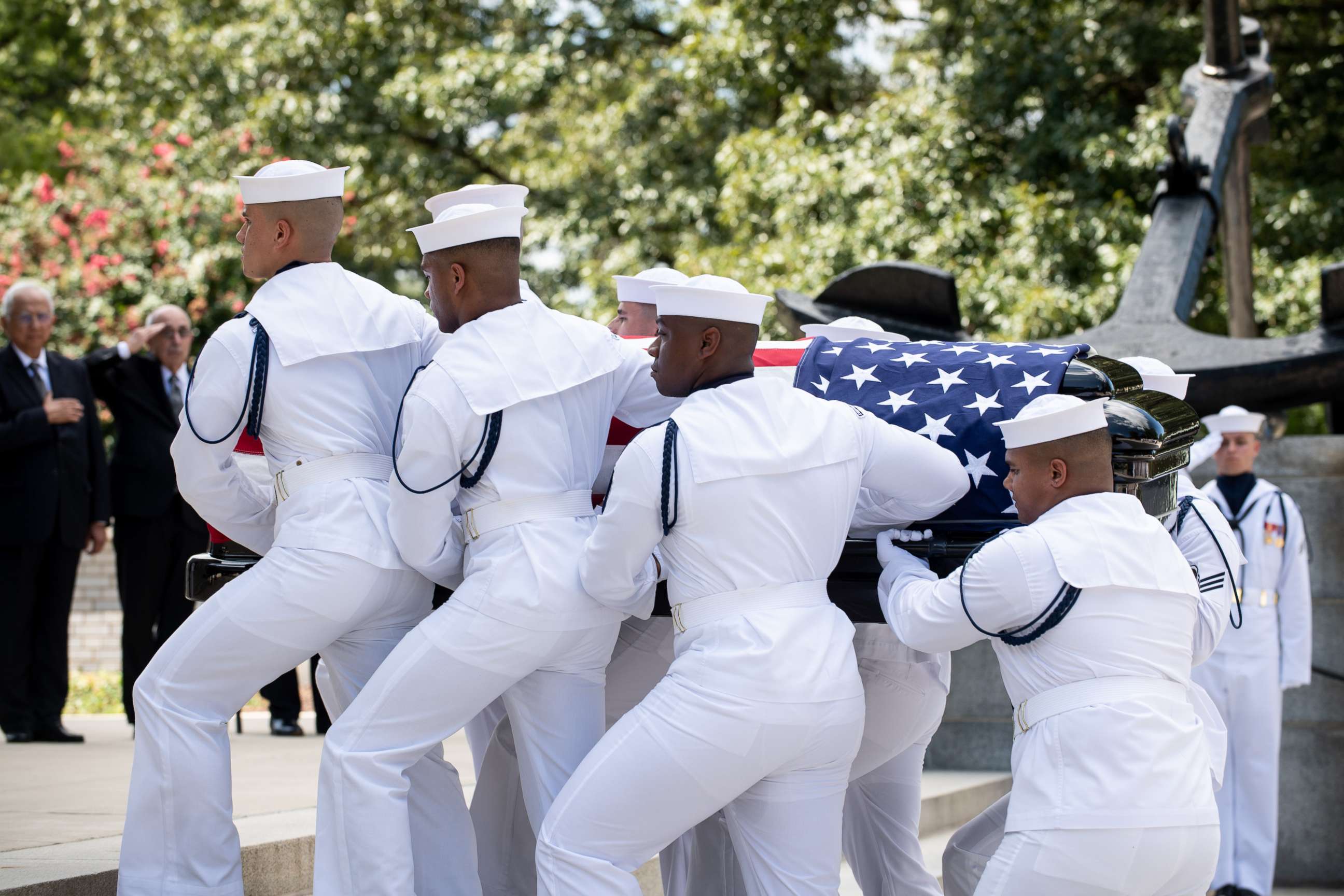 Navy Body Bearers move the casket of the late Sen. John McCain from his processional hearse to the United States Naval Academy Chapel, Sept. 2, 2018. John Sidney McCain, III graduated from the United States Naval Academy in 1958. 