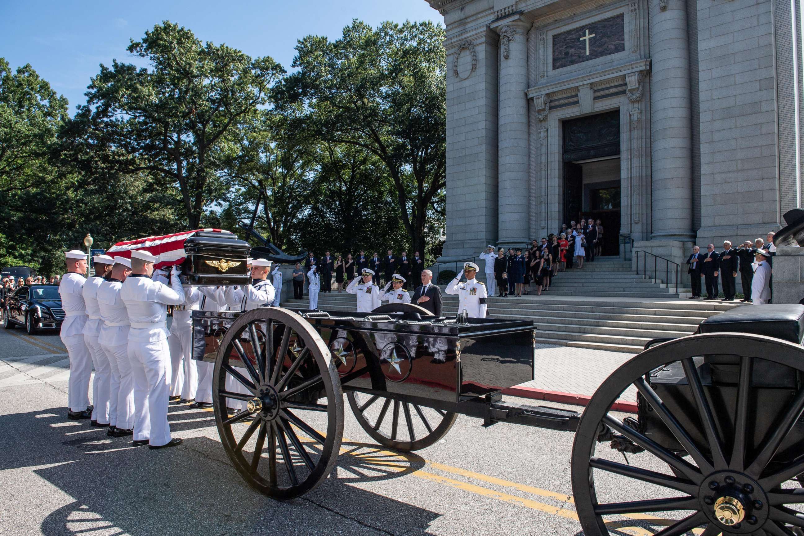 Navy Body Bearers place the casket of the late Sen. John McCain onto a horse-drawn caisson after his funeral service at the United States Naval Academy Chapel, Sept. 2, 2018. John Sidney McCain, III graduated from the United States Naval Academy in 1958. 