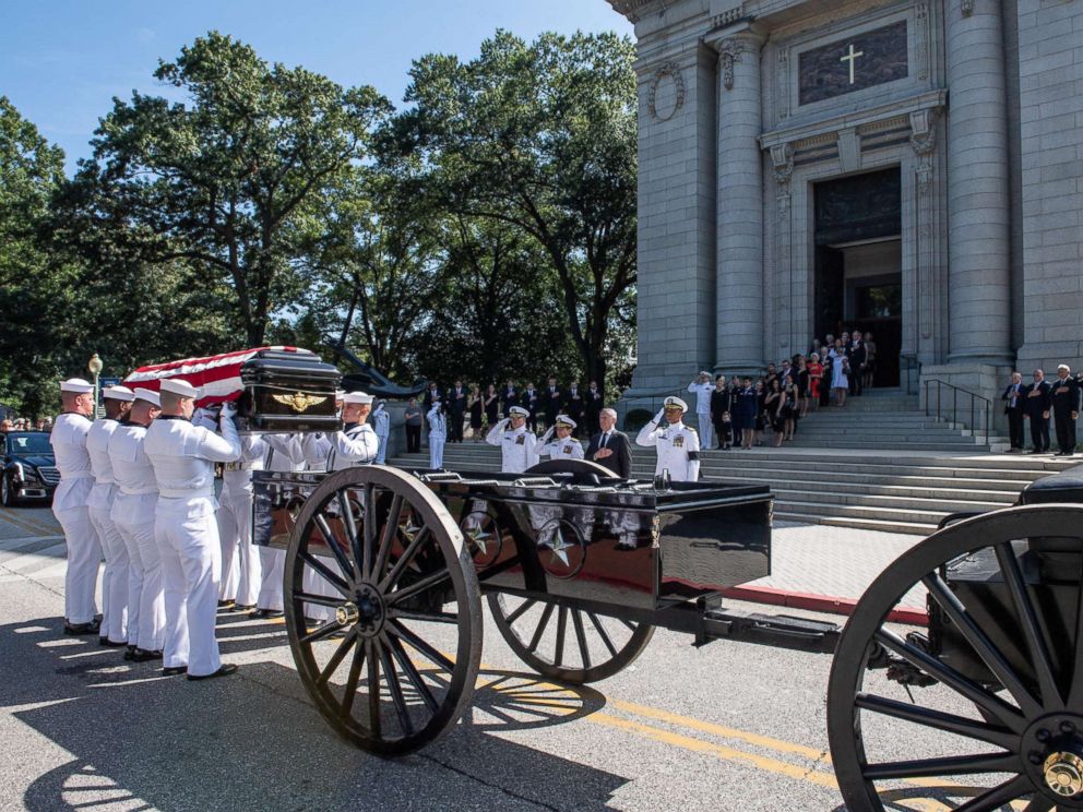 Navy Body Bearers place the casket of the late Sen. John McCain onto a horse-drawn caisson after his funeral service at the United States Naval Academy Chapel, Sept. 2, 2018. John Sidney McCain, III graduated from the United States Naval Academy in 1958.