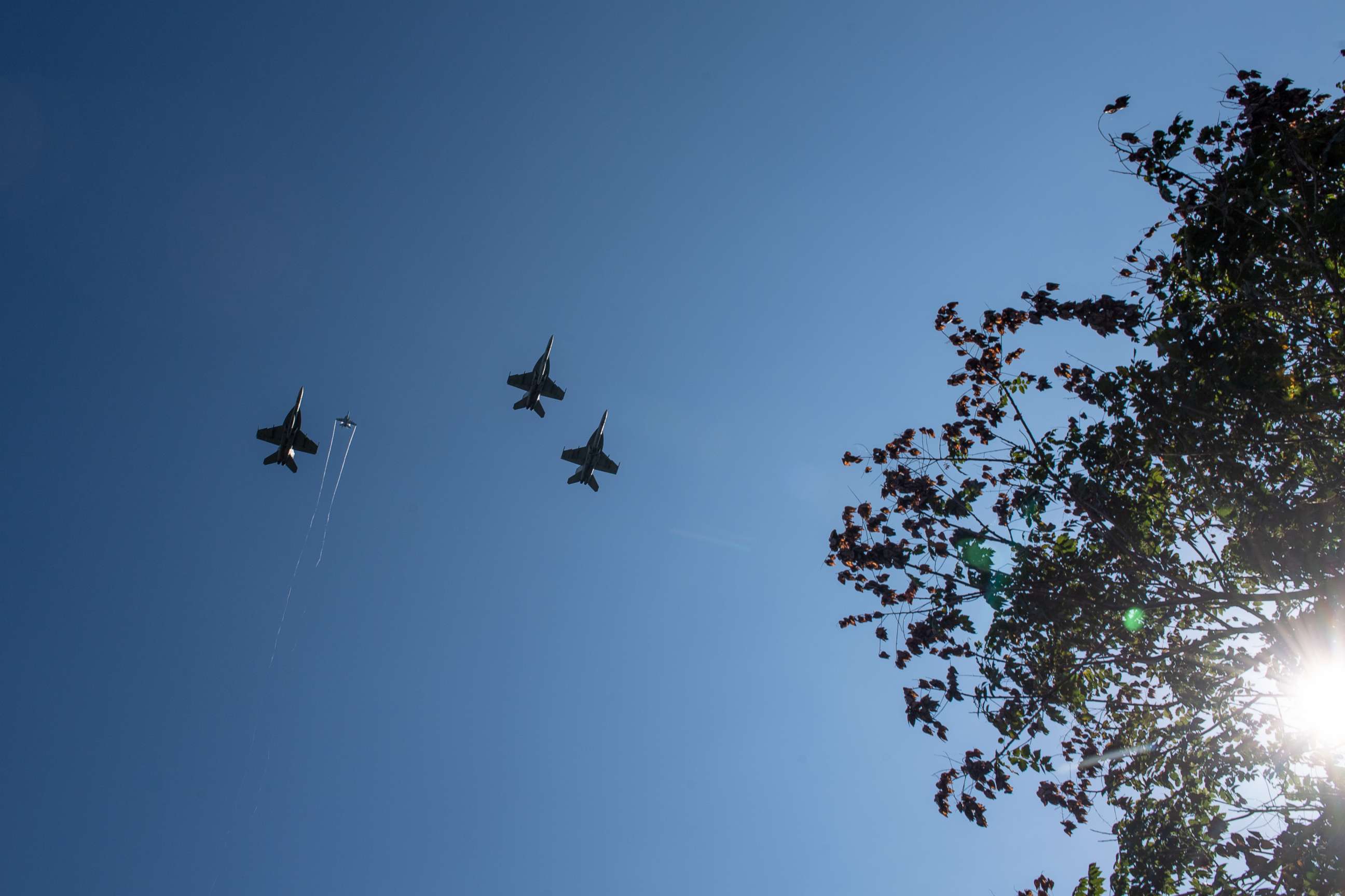 F/A-18 Super Hornets from Strike Fighter Squadrons (VFA) 31, VFA-32, VFA-87 and VFA-105 honor the late Sen. John McCain with a fly-over of the United States Naval Academy during his burial service, Sept. 2, 2018. 