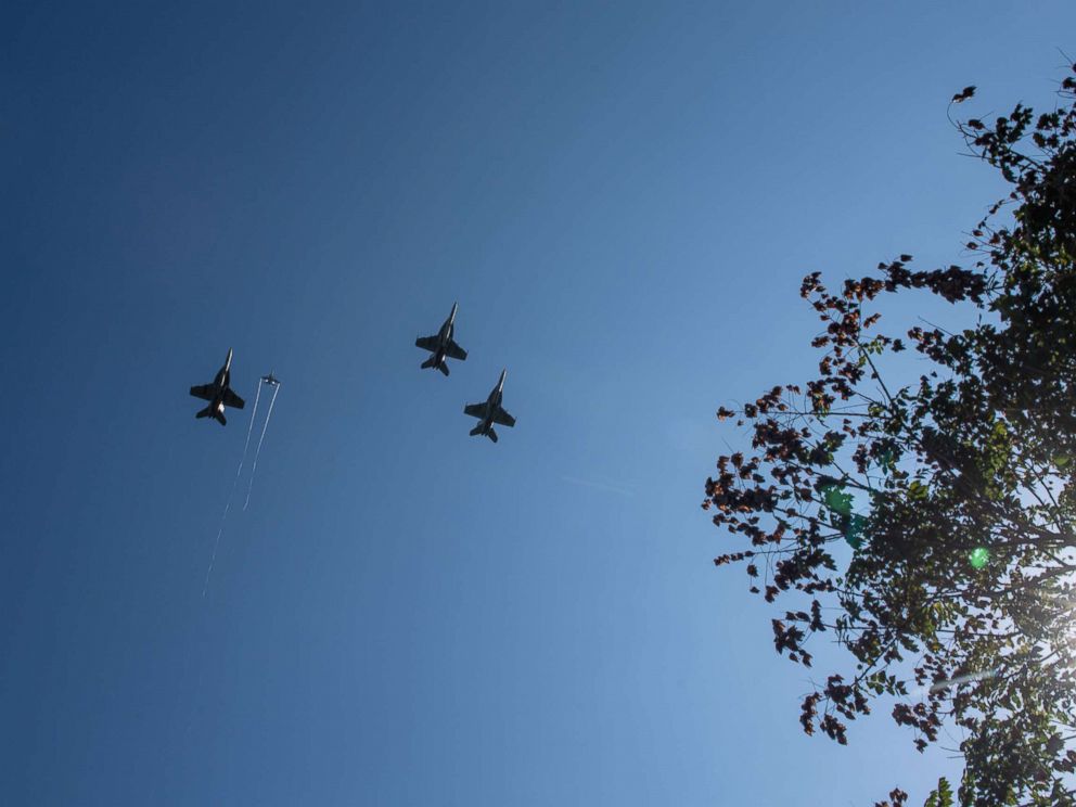 F/A-18 Super Hornets from Strike Fighter Squadrons (VFA) 31, VFA-32, VFA-87 and VFA-105 honor the late Sen. John McCain with a fly-over of the United States Naval Academy during his burial service, Sept. 2, 2018.