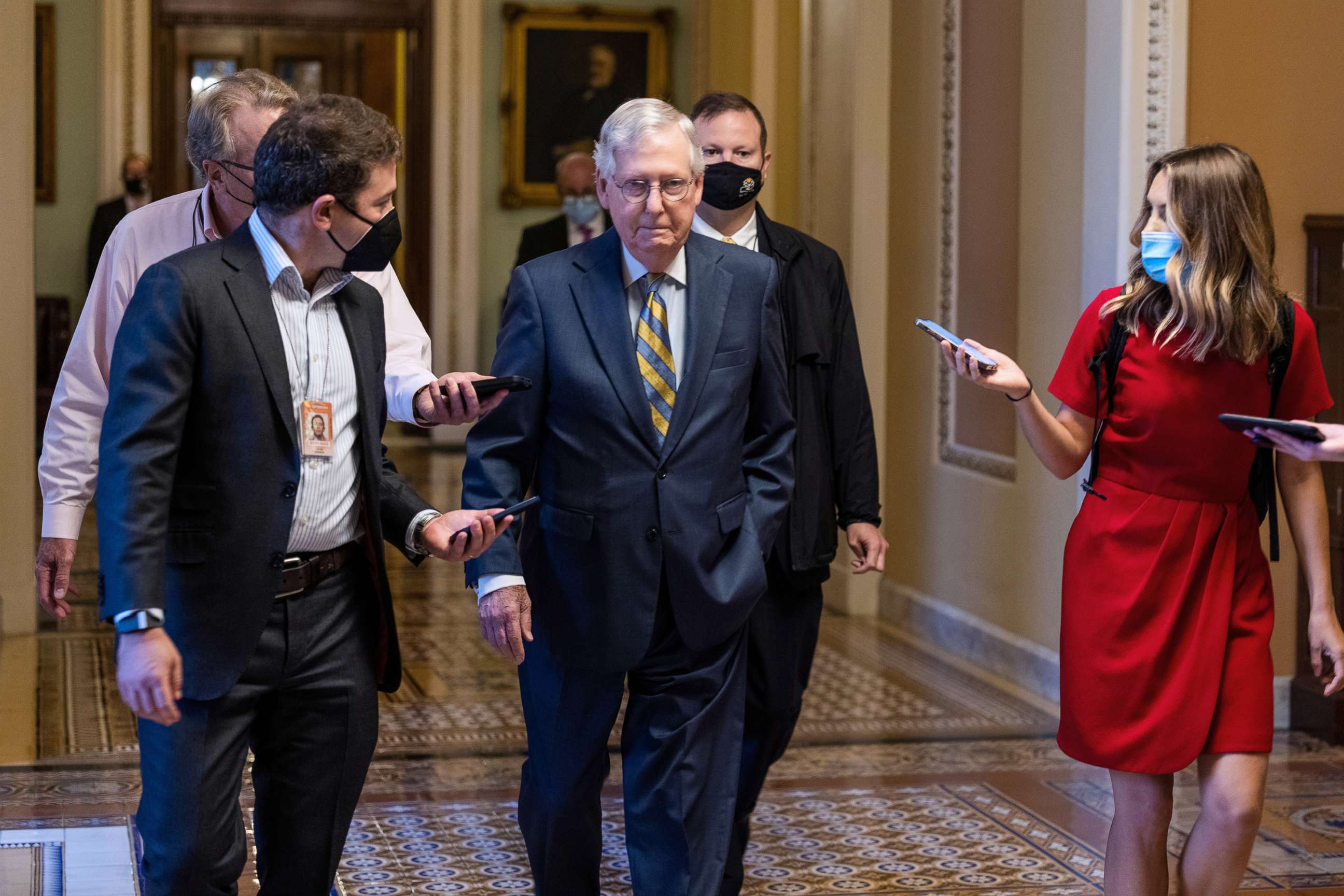 PHOTO: Republican Senate Minority Leader Mitch McConnell walks to his office ahead of a procedural vote to raise the debt limit in Washington, D.C., Oct. 6, 2021. 