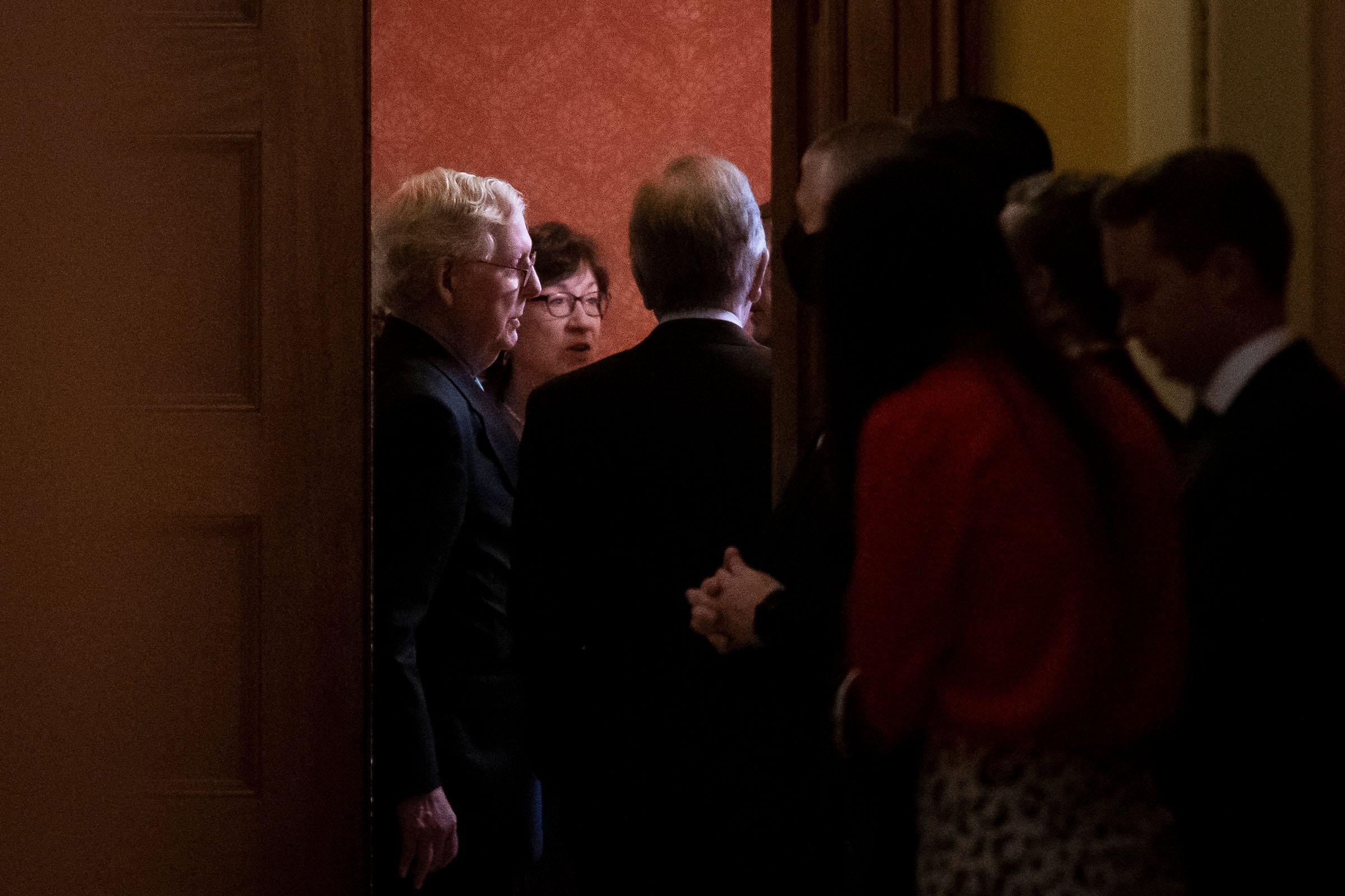 PHOTO: Senate Minority Leader Mitch McConnell, Sen. Susan Collins, and Sen. Roy Blunt are seen through a doorway as Senate Republicans meet behind closed doors to discuss the debt ceiling vote at the U.S. Capitol in Washington, D.C., Oct. 7, 2021.