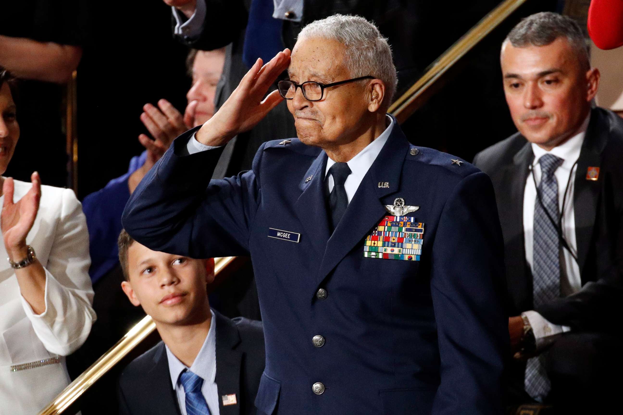 PHOTO: Tuskegee airman Charles McGee, 100, salutes as his great grandson Iain Lanphier looks as President Donald Trump delivers his State of the Union address to a joint session of Congress on Capitol Hill in Washington, Tuesday, Feb. 4, 2020.