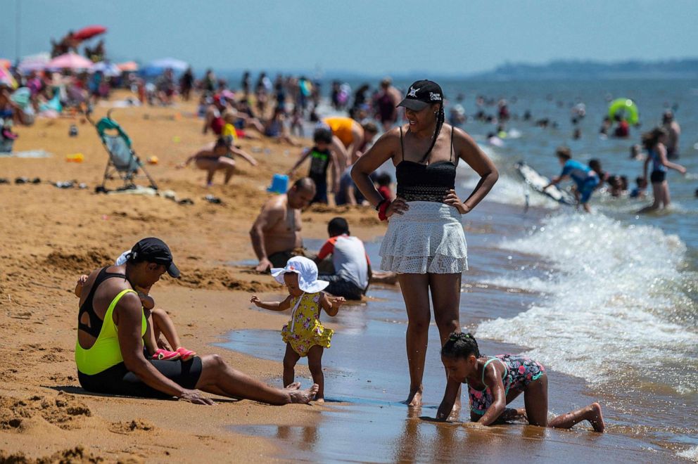 PHOTO: People play on the beach as they try to escape the heat at Sandy Point State Park in Annapolis, Md., June 29, 2021.