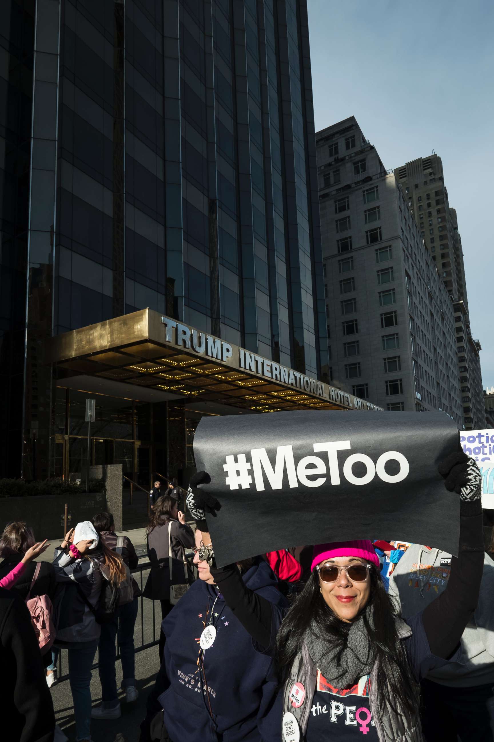 PHOTO: A demonstrator holds up a  banner saying "#MeToo" in front of Trump International Hotel and Tower during the second annual Women's March in New York, Jan. 20, 2018. 