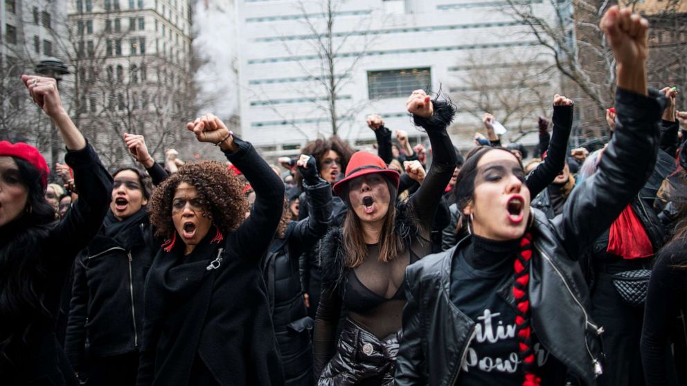 PHOTO: In this Jan. 10, 2020, file photo, women protest rape in court as Harvey Weinstein attends a pretrial session in New York City.