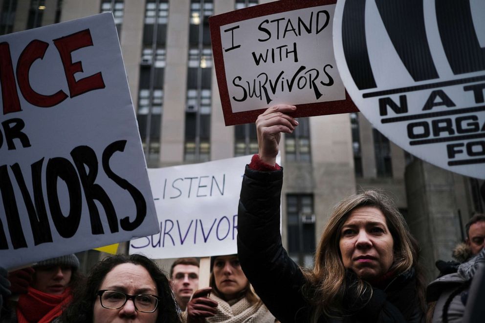PHOTO: In this Jan. 6, 2020, file photo, protesters gather as Harvey Weinstein arrives at a Manhattan court house for the start of his trial in New York.