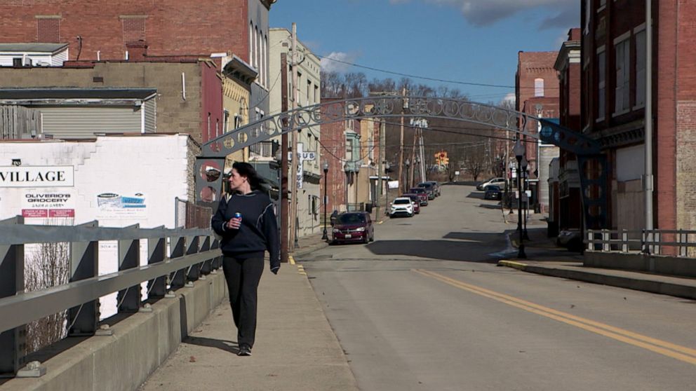 PHOTO: Meaghan Malcolmb walks the streets of Clarksburg, West Virginia, which has been hit hard by the opioid and fentanyl crises.