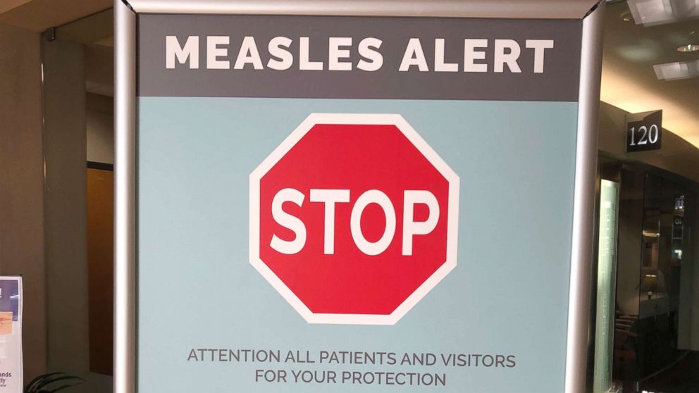 PHOTO: Signs are posted at The Vancouver Clinic in Vancouver, Wash., to warn patients and visitors of a measles outbreak, Jan. 30, 2019.