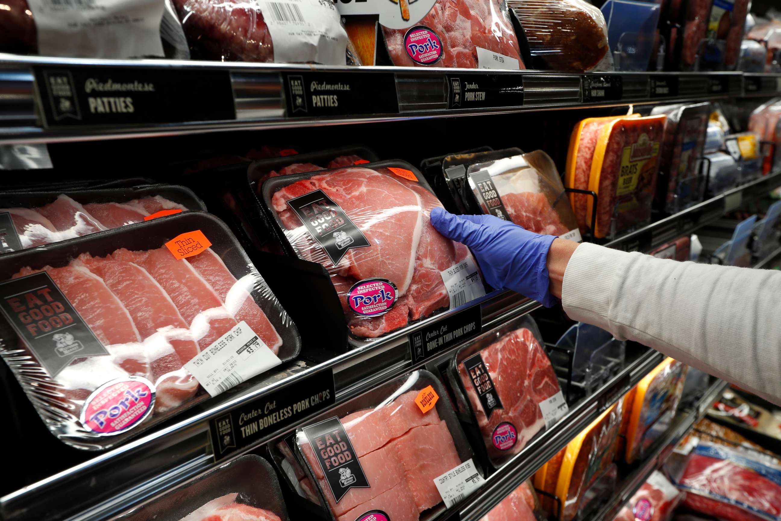 PHOTO: A customer reaches for a packaged pork at Westborn Market in Berkley, Mich., Wednesday, April 29, 2020.