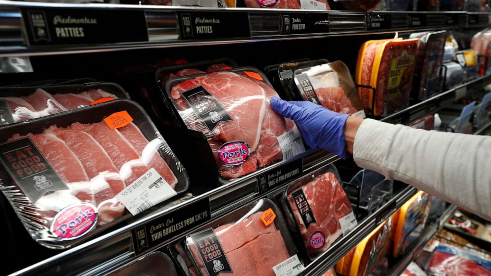 PHOTO: A customer reaches for a packaged pork at Westborn Market in Berkley, Mich., Wednesday, April 29, 2020.