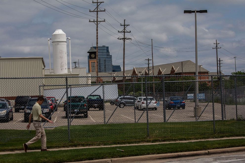 PHOTO: A person walks in front of Viant, a medical device manufacturer in Grand Rapids, Mich., June 18, 2019.