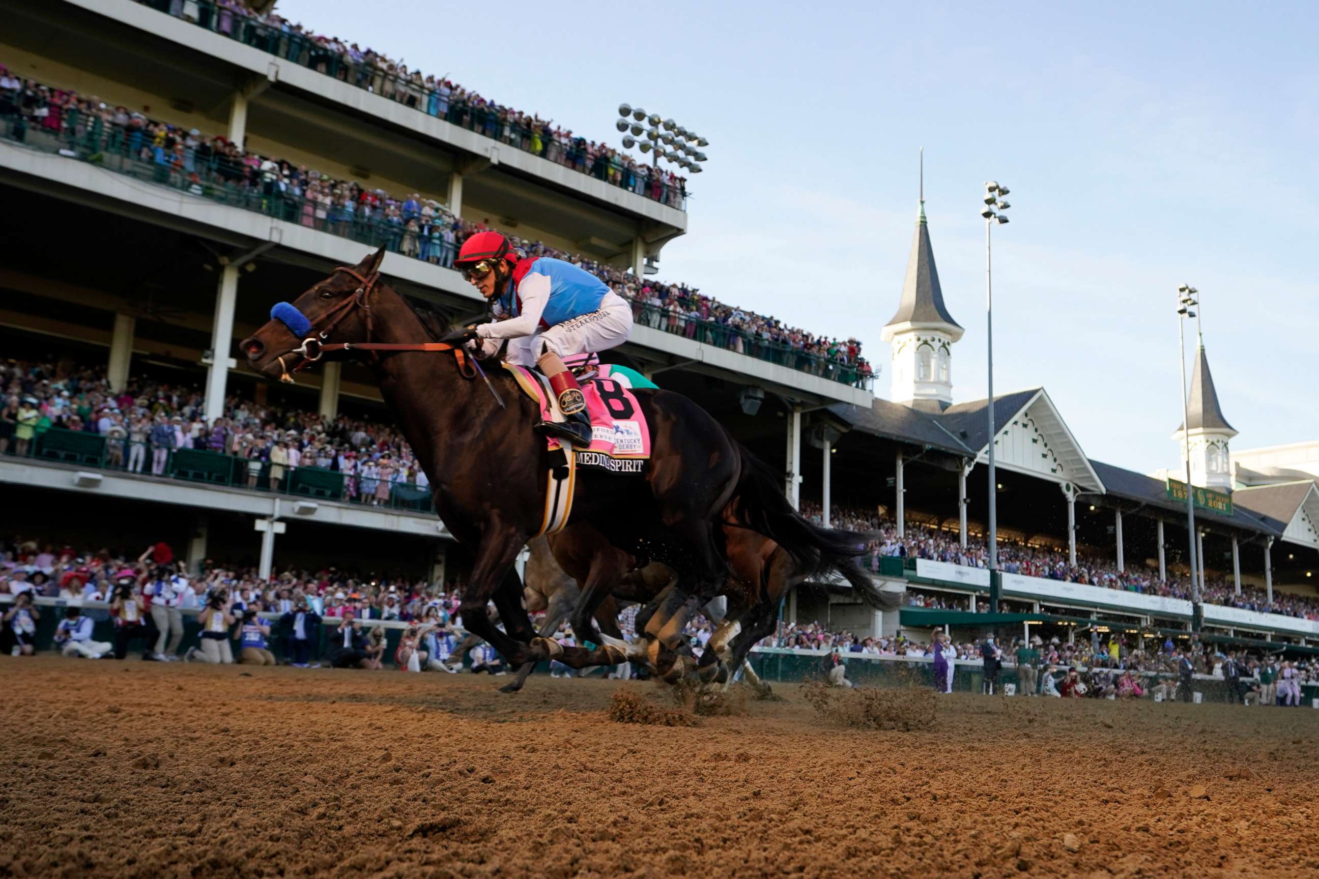 PHOTO: John Velazquez rides Medina Spirit across the finish line to win the 147th running of the Kentucky Derby at Churchill Downs, May 1, 2021, in Louisville, Ky.