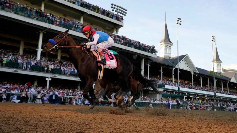 PHOTO: John Velazquez rides Medina Spirit across the finish line to win the 147th running of the Kentucky Derby at Churchill Downs, May 1, 2021, in Louisville, Ky.