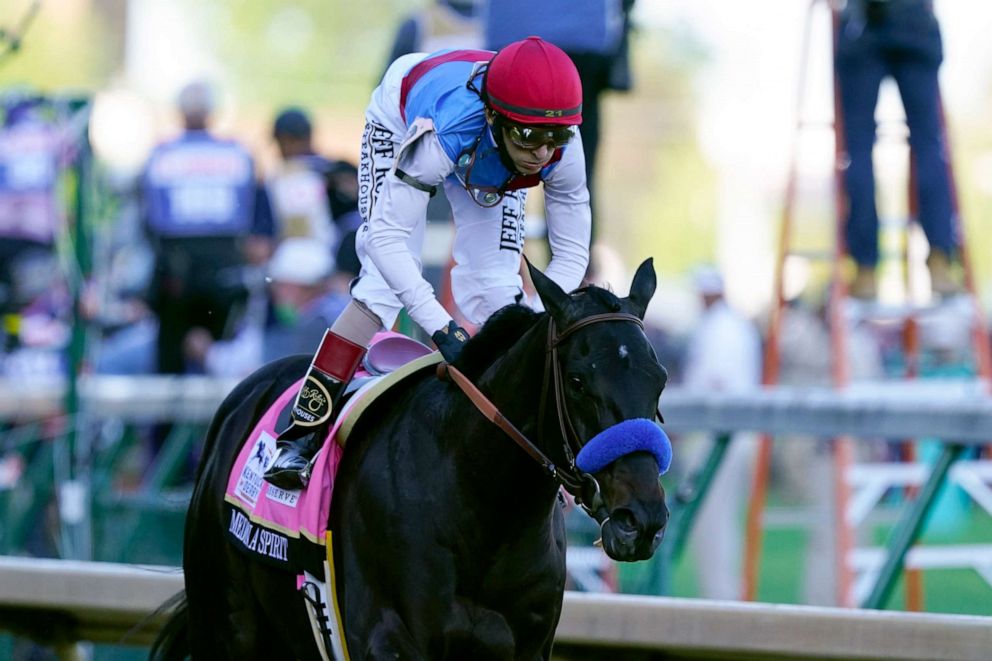 PHOTO: John Velazquez rides Medina Spirit to victory in the 147th running of the Kentucky Derby at Churchill Downs, May 1, 2021, in Louisville, Ky.