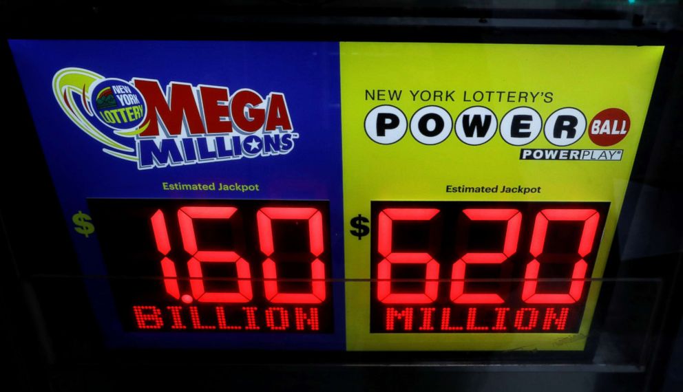 PHOTO: Signs display the jackpots for Tuesday's Mega Millions and Wednesday's Powerball lottery drawings in New York, Oct. 22, 2018. 