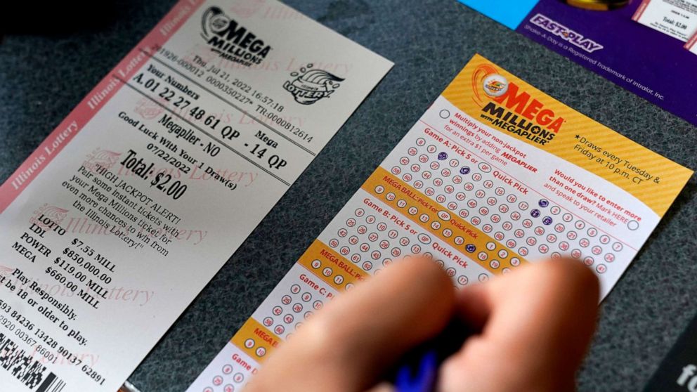 PHOTO: A customer fills out a Mega Millions lottery ticket at a convenience store, July 21, 2022, in Northbrook, Ill.