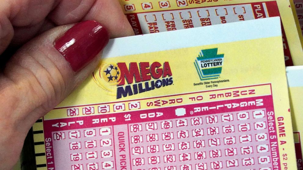 PHOTO: FILE - A Mega Millions wagering slip is held in Cranberry Township, Pa., Jan. 12, 2023.