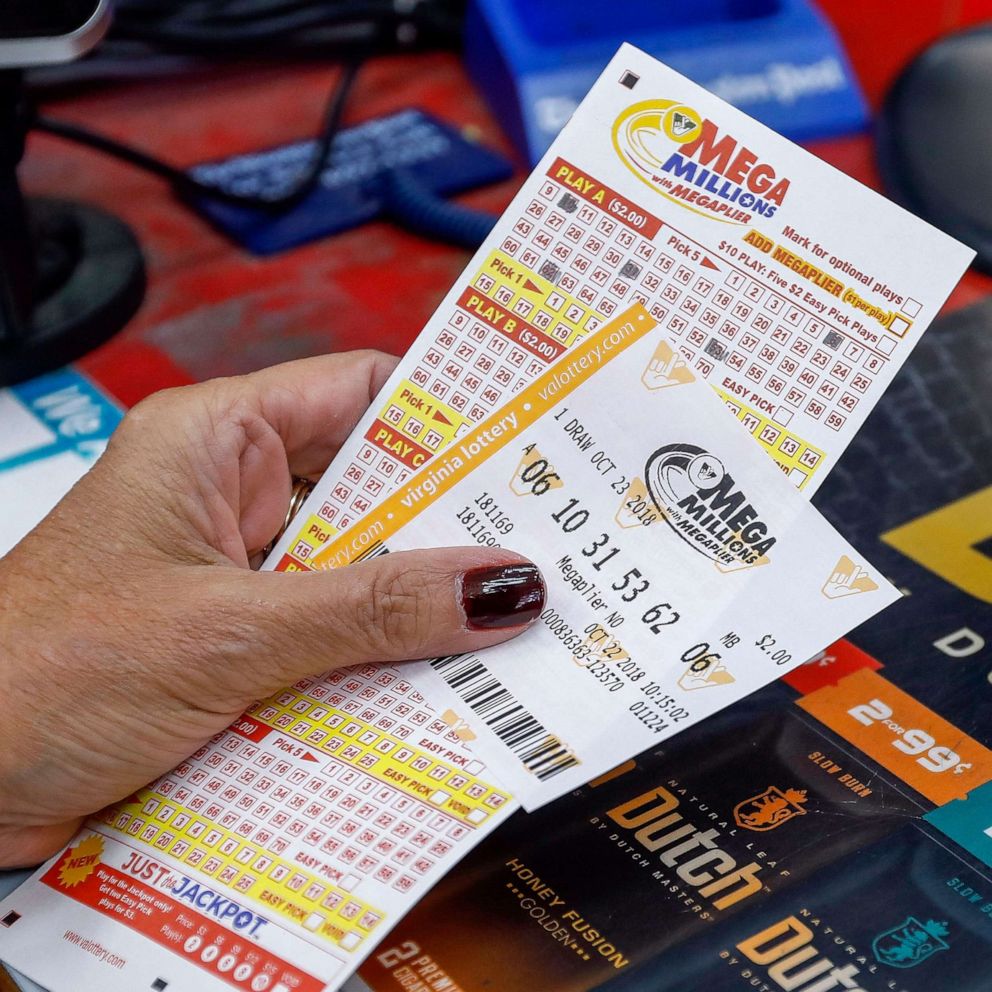PHOTO: In this Oct. 22, 2018, file photo, a customer purchases Mega Millions lottery tickets at a retailer in Arlington, Virginia.