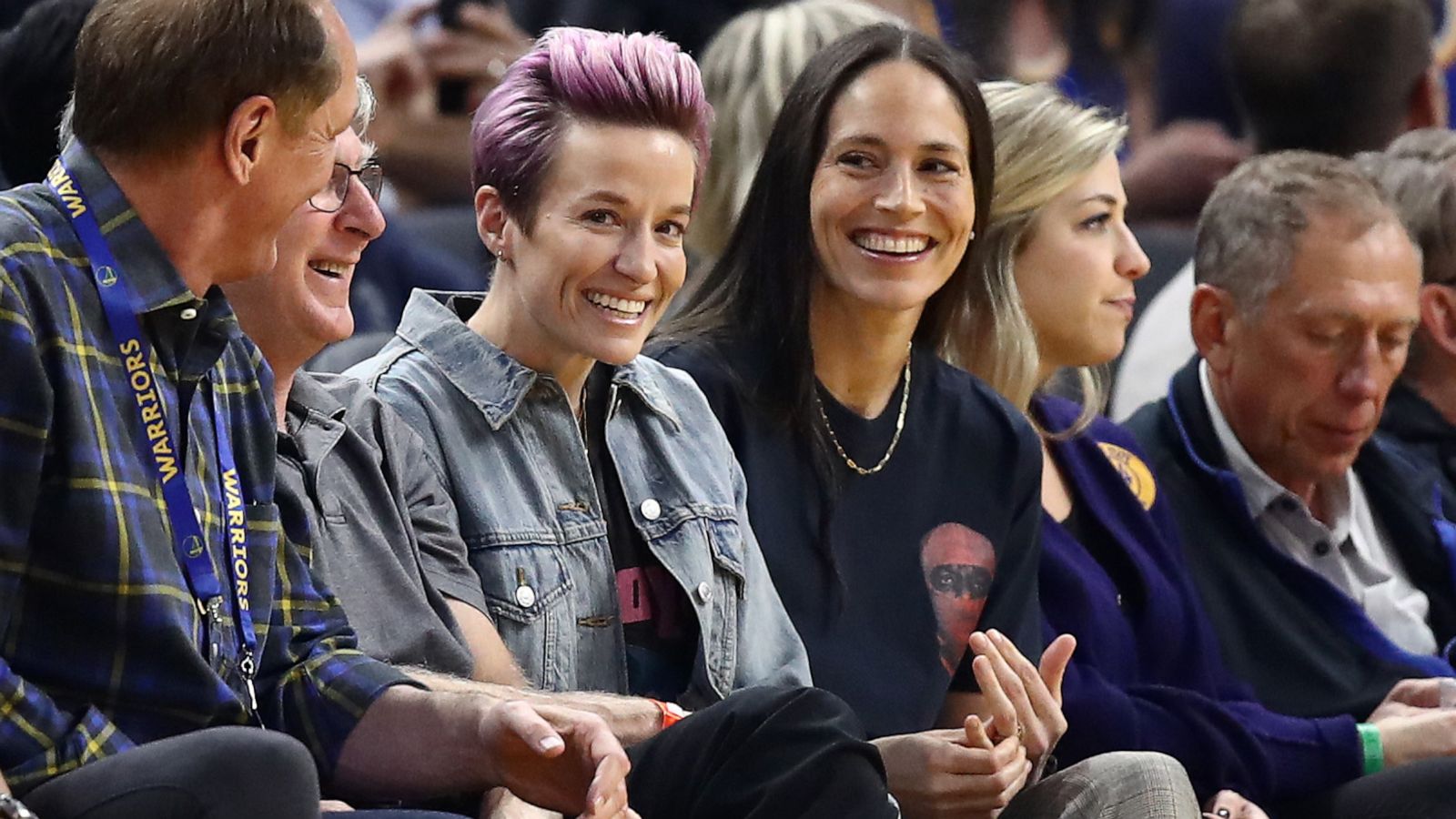 PHOTO: Soccer star Megan Rapinoe and WNBA star Sue Bird watch the Golden State Warriors play against the Phoenix Suns at Chase Center on October 30, 2019 in San Francisco, California.