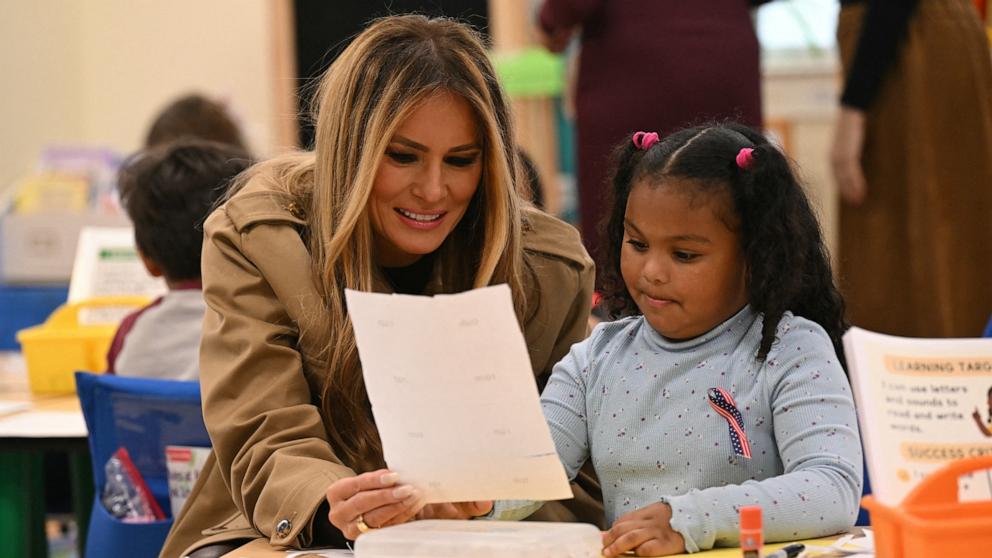 PHOTO: First Lady Melania Trump speaks with a student at DeLalio Elementary School at Marine Corps Air Station New River in Jacksonville, North Carolina, November 19, 2025, as they travel to visit military families.