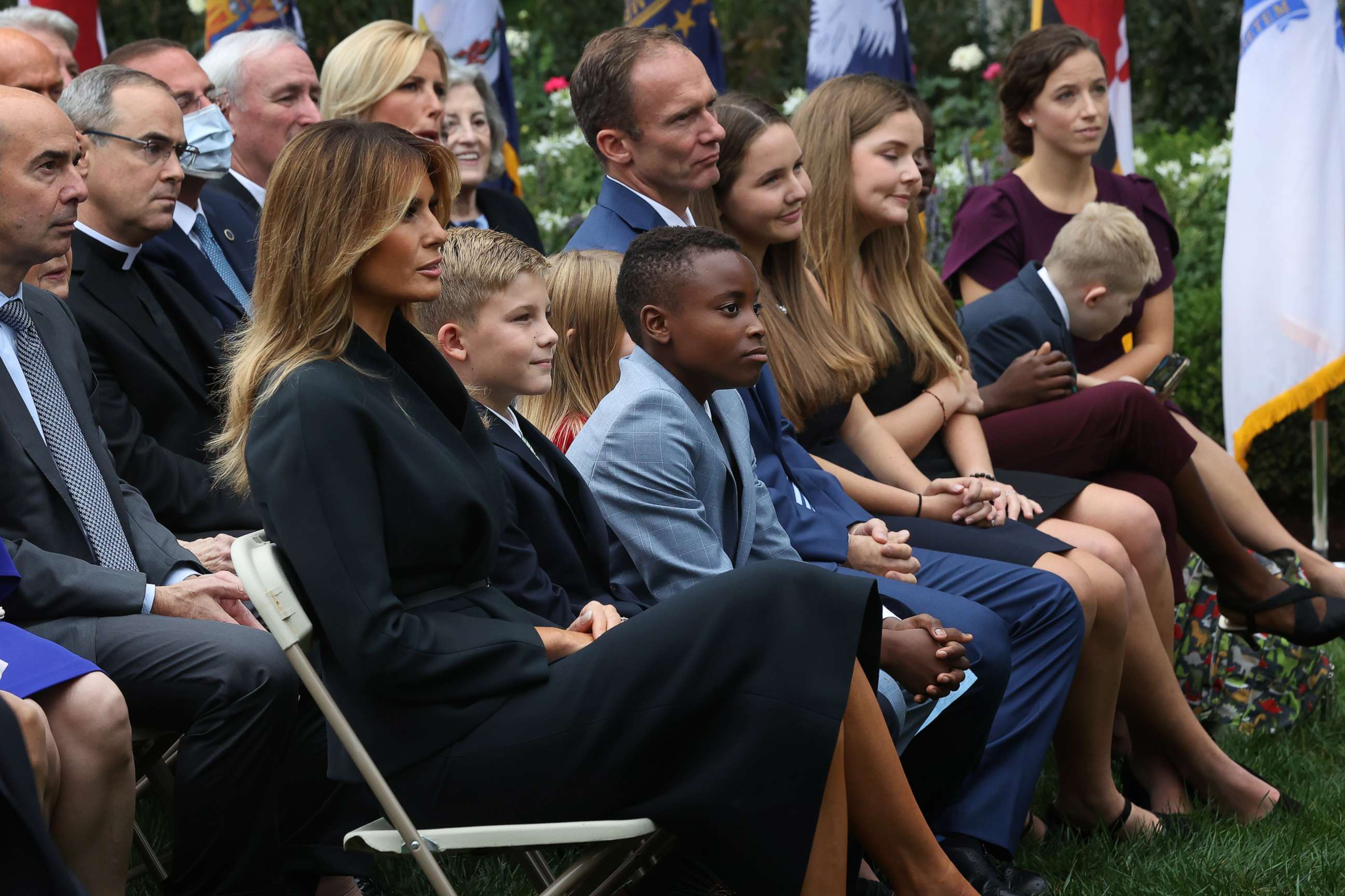 First lady Melania Trump sits next to Seventh Circuit Court Judge Amy Coney Barrett's family as President Donald Trump announces Barrett's nomination to the Supreme Court in the Rose Garden at the White House, Sept. 26, 2020, in Washington.