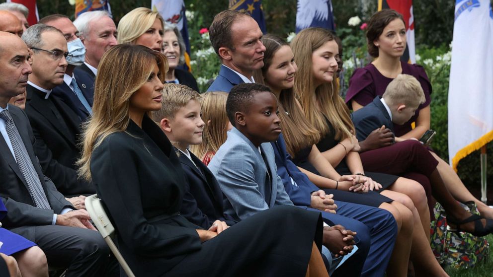 First lady Melania Trump sits next to Seventh Circuit Court Judge Amy Coney Barrett's family as President Donald Trump announces Barrett's nomination to the Supreme Court in the Rose Garden at the White House, Sept. 26, 2020, in Washington.