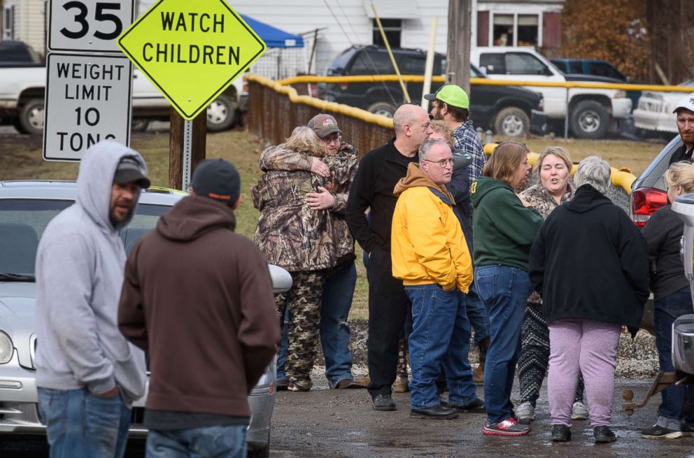 PHOTO: Family members and friends console each other near Ed's Car Wash where several people were found dead and one injured after a shooting, Jan. 28, 2018 in Melcroft, Pa.