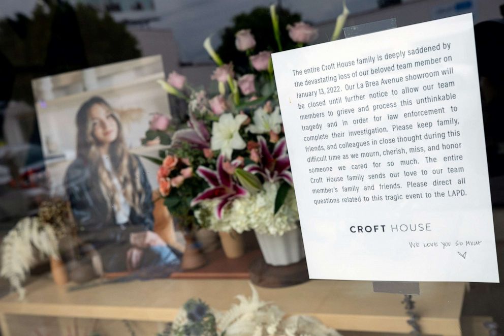 PHOTO: Flowers are placed outside Croft House furniture store in memory of graduate student Brianna Kupfer, Jan. 17, 2022.