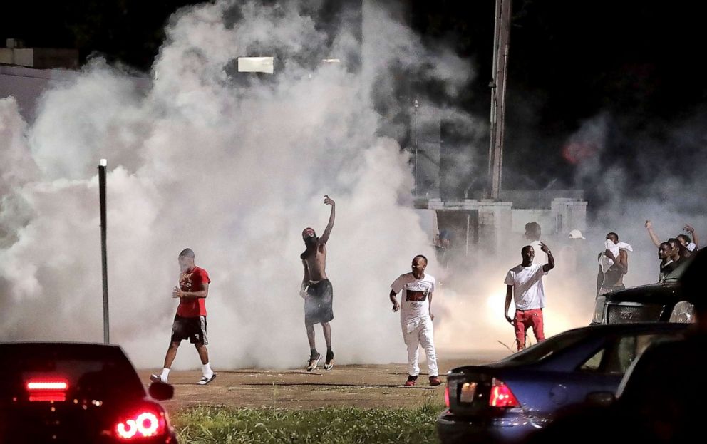 PHOTO: Frayser community residents taunt authorities as protesters take to the streets in anger against the shooting of a youth identified by family members as Brandon Webber by U.S., June 12, 2019, in Memphis, Tenn.