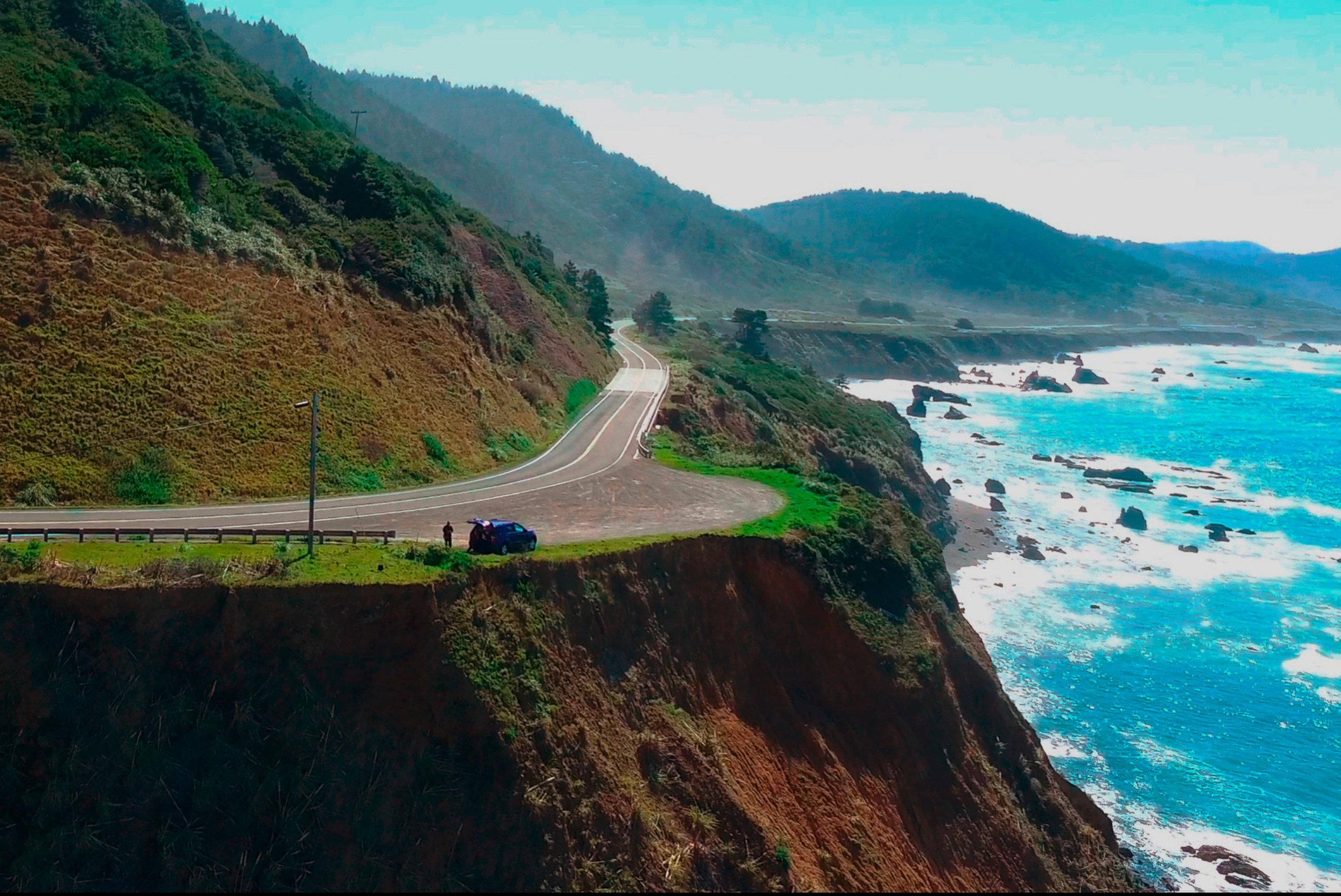 In this Wednesday, March 28, 2018 aerial image from Alameda County Sheriff's Office drone video courtesy of Mendocino County shows the pullout where the SUV of Jennifer and Sarah Hart was recovered off the Pacific Coast Highway 1, near Westport, Calif.