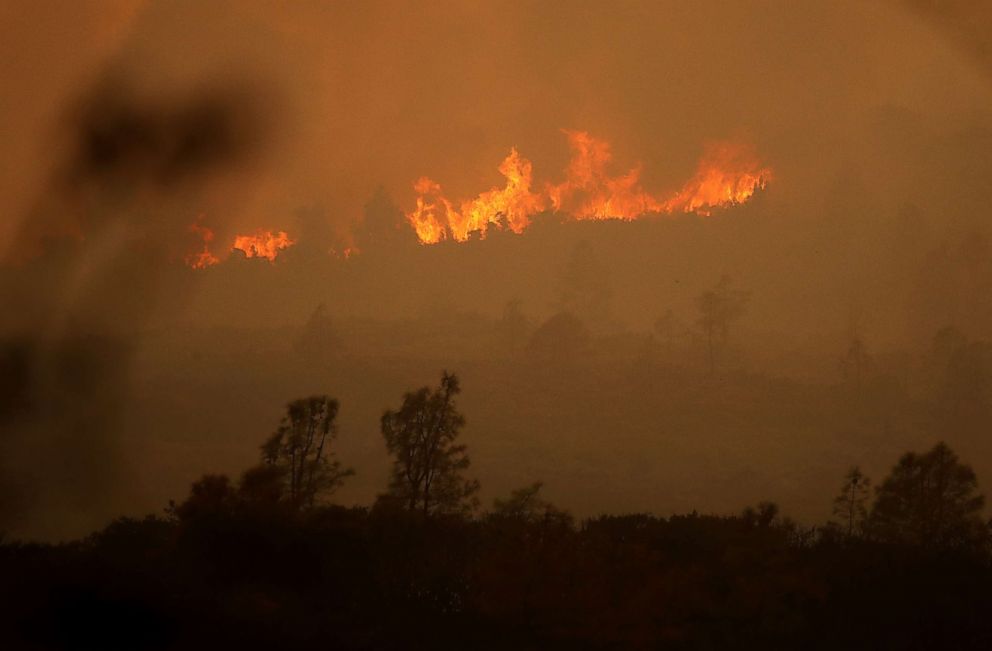 PHOTO: Flames from the Mendocino Complex fire burn a ridge, Aug. 8, 2018, near Lodoga, California.