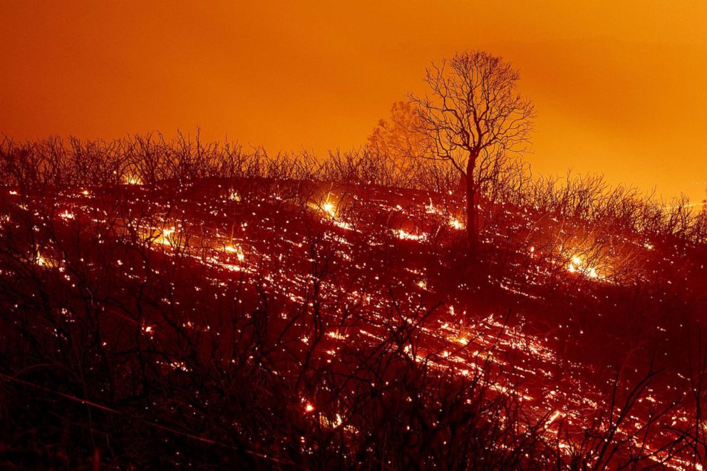 PHOTO: Embers smolder along a hillside after the Ranch Fire, part of the Mendocino Complex Fire, burned though the area near Clearlake Oaks, Calif., Aug. 5, 2018.