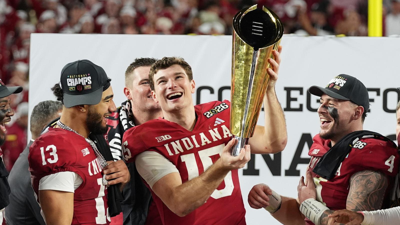 PHOTO: Indiana quarterback Fernando Mendoza holds the trophy after Indiana defeated Miami in a College Football Playoff national championship game in Miami Gardens, Fla., Jan. 19, 2026,