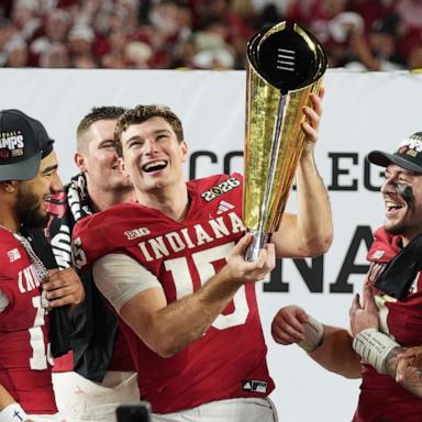 PHOTO: Indiana quarterback Fernando Mendoza holds the trophy after Indiana defeated Miami in a College Football Playoff national championship game in Miami Gardens, Fla., Jan. 19, 2026, 