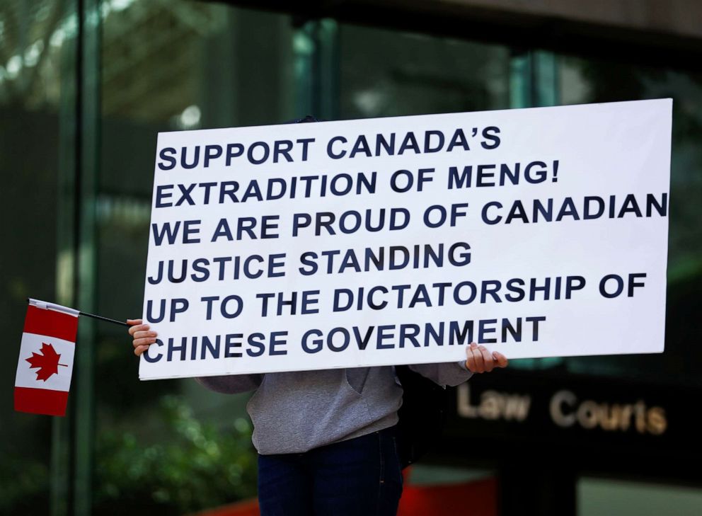 PHOTO: A person holds a sign supporting the extradition of Huawei's Financial Chief Meng Wanzhou outside of British Columbia Supreme Court building in Vancouver, Canada, May 8, 2019.