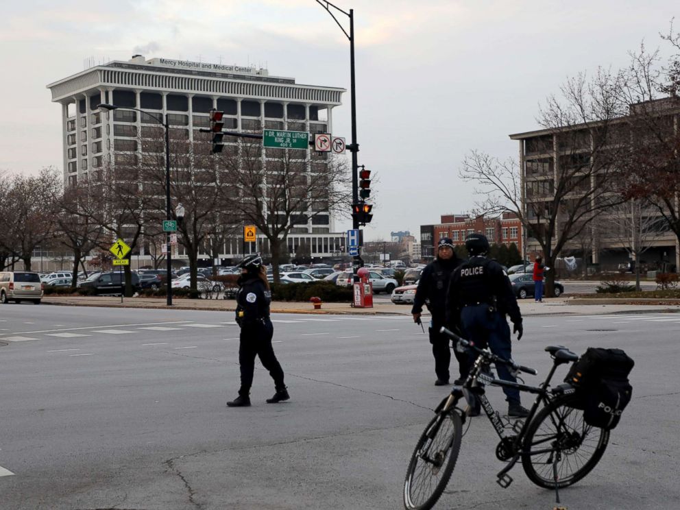 PHOTO: Police stand near Mercy Hospital, Nov. 19, 2018, after multiple people were reported shot on the Near South Side of Chicago.
