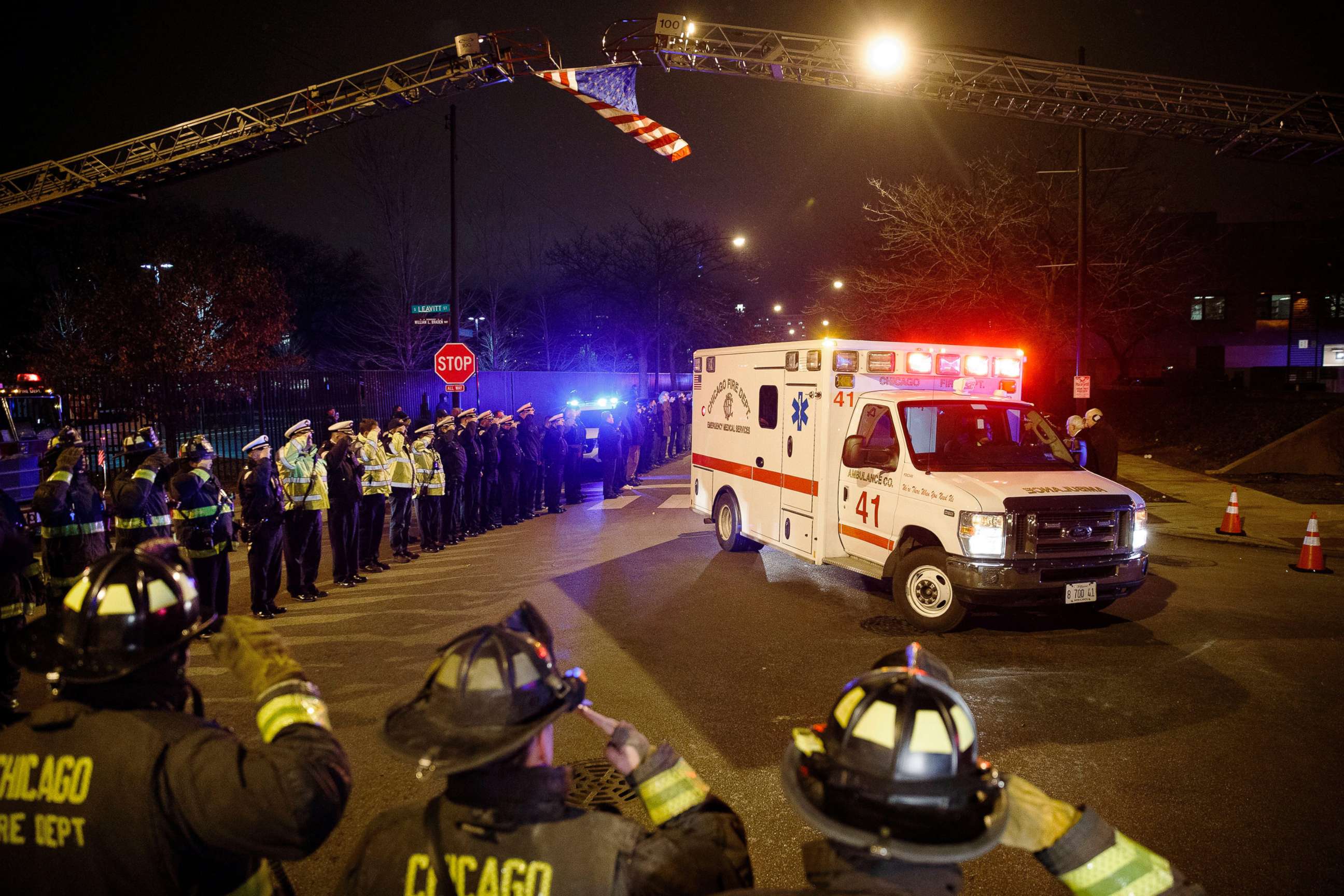 PHOTO: Police and firefighters salute as an ambulance arrives at the medical examiner's office carrying the body of Chicago Police Department Officer Samuel Jimenez, who was killed during a shooting at Mercy Hospital, Nov. 19, 2018, in Chicago.