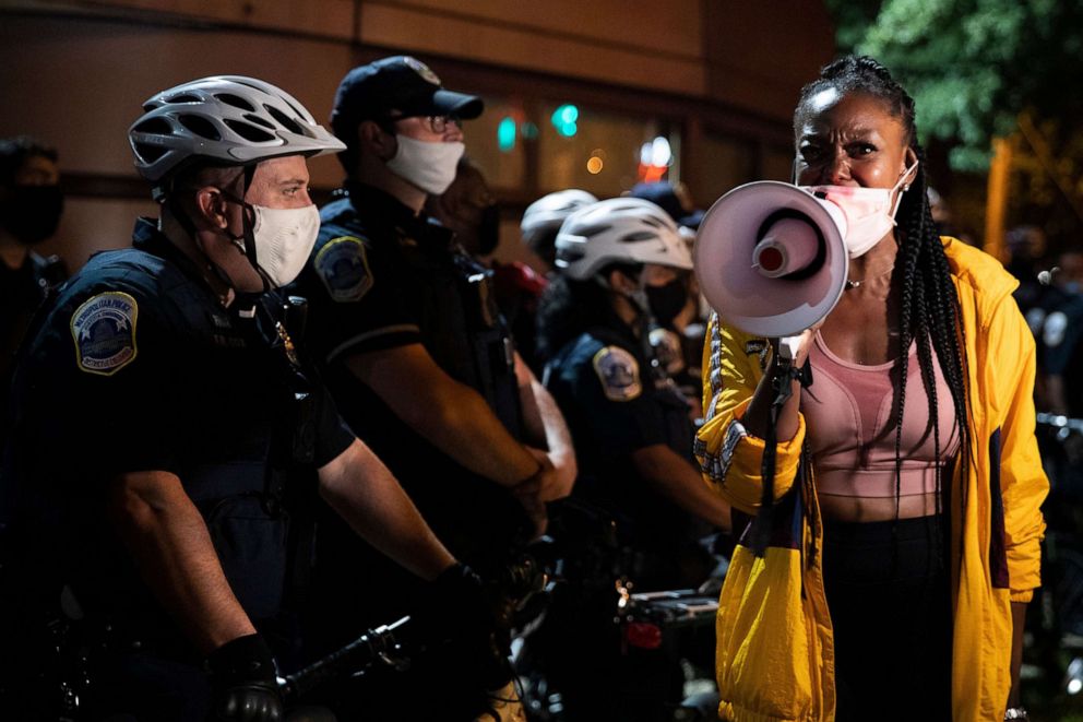 PHOTO: Demonstrators face off with Metropolitan Police Department officers at the 7th District police station after an officer shot and killed a man in Washington, D.C., Sept. 2, 2020. 