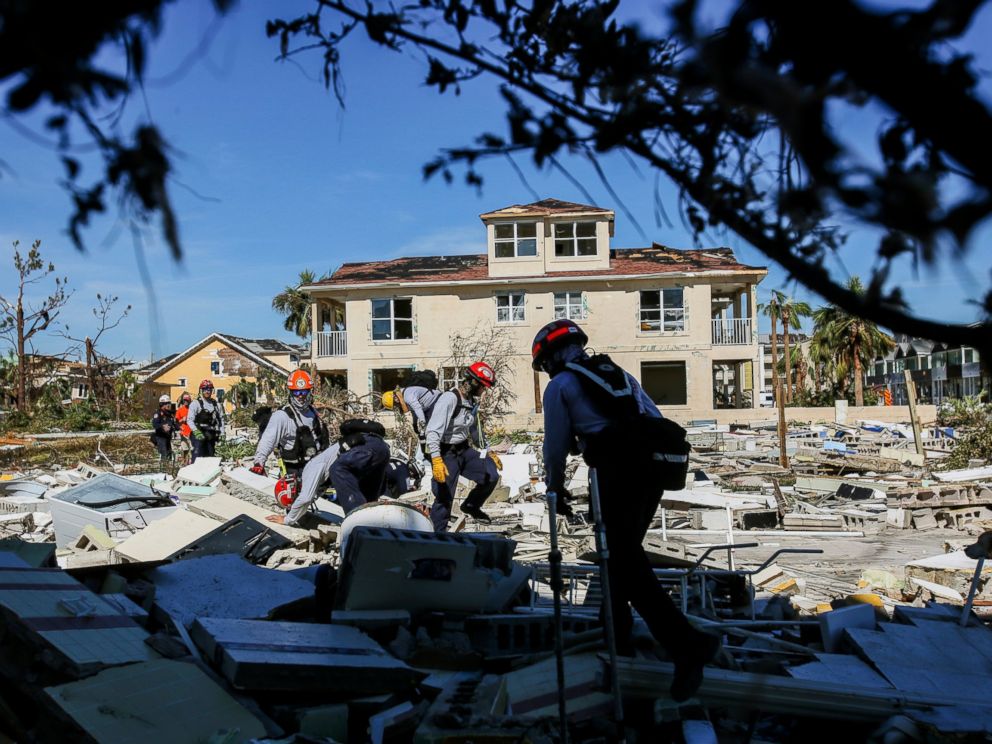 PHOTO: South Florida task force members search a shaved house destroyed by Hurricane Michael in Mexico Beach, Florida, on Friday, October 12, 2018 after the passage of Hurricane Michael in the region, Wednesday.