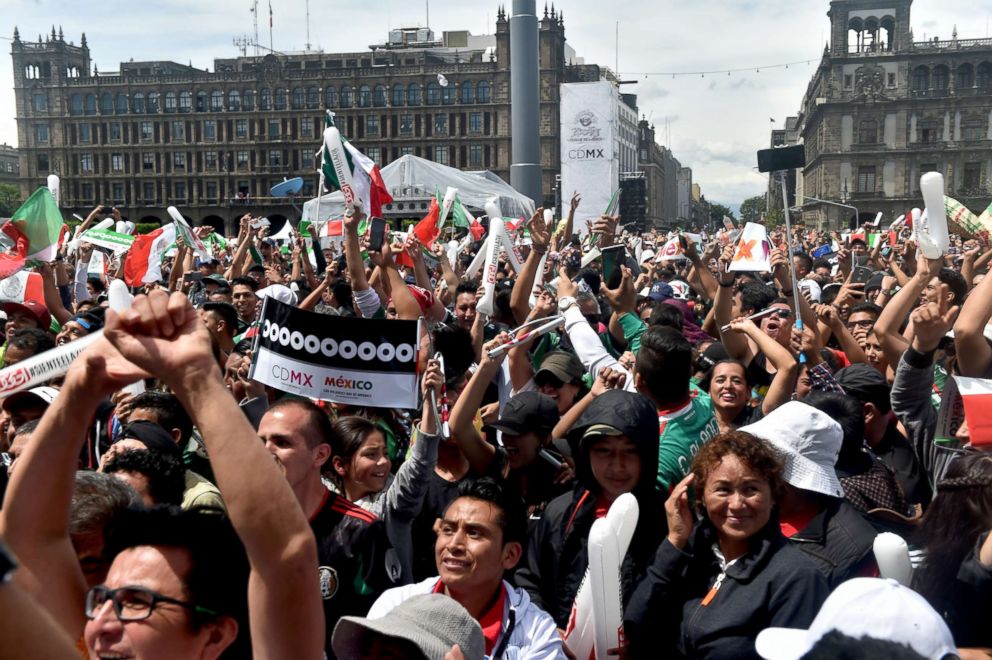 PHOTO: Fans of Mexico's football team celebrate during a public event at the Zocalo Square in Mexico City, June 17 2018.