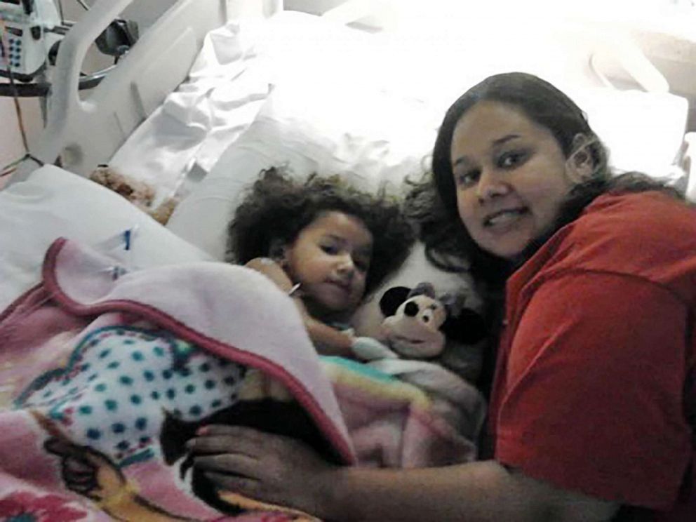 PHOTO: Abigale by Miah's side at the hospital shortly after Miah's tumor surgery at age 3.