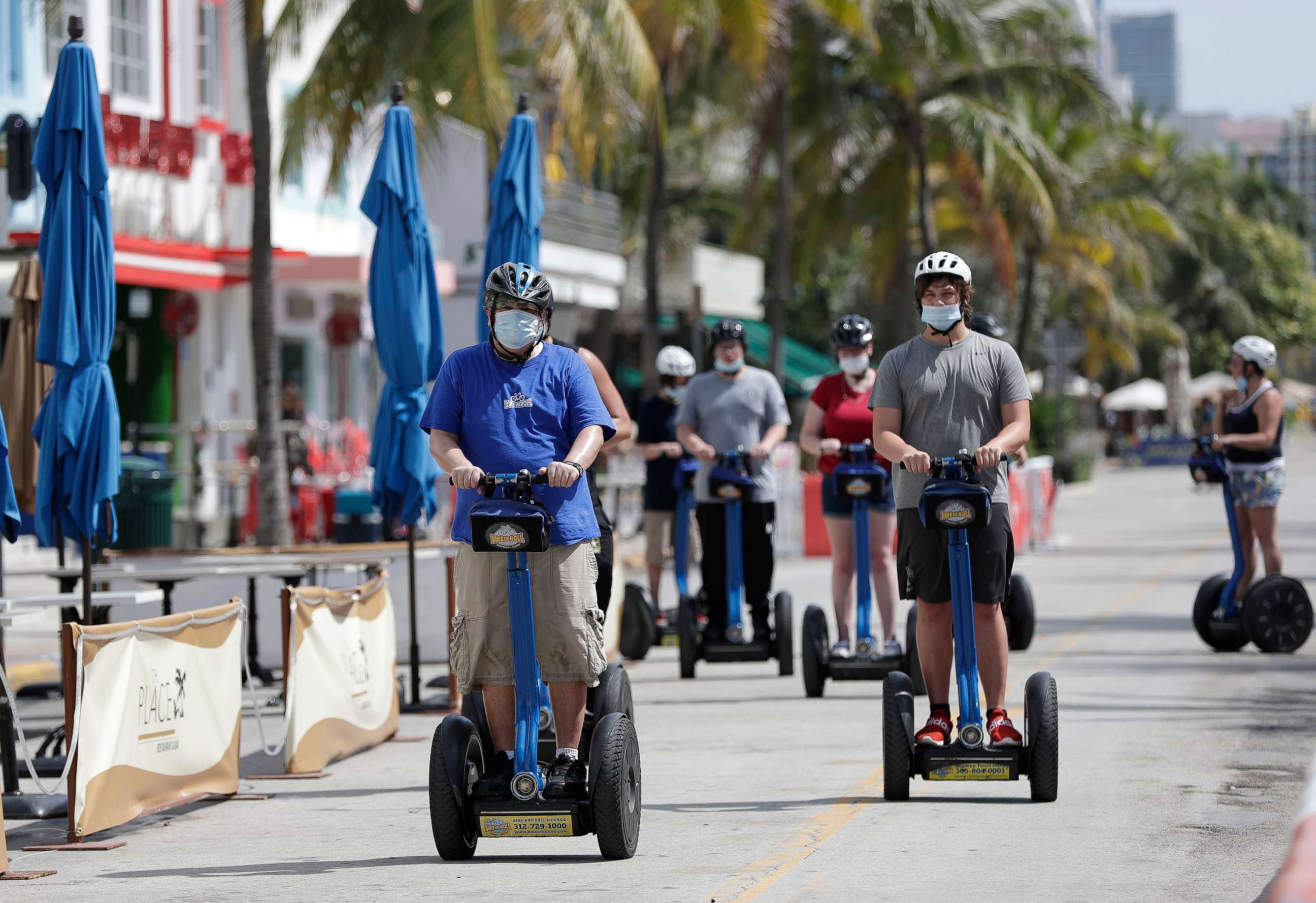 PHOTO: A tour group riding Segways rides down Miami Beach, Florida's famed Ocean Drive on South Beach, July 4, 2020.