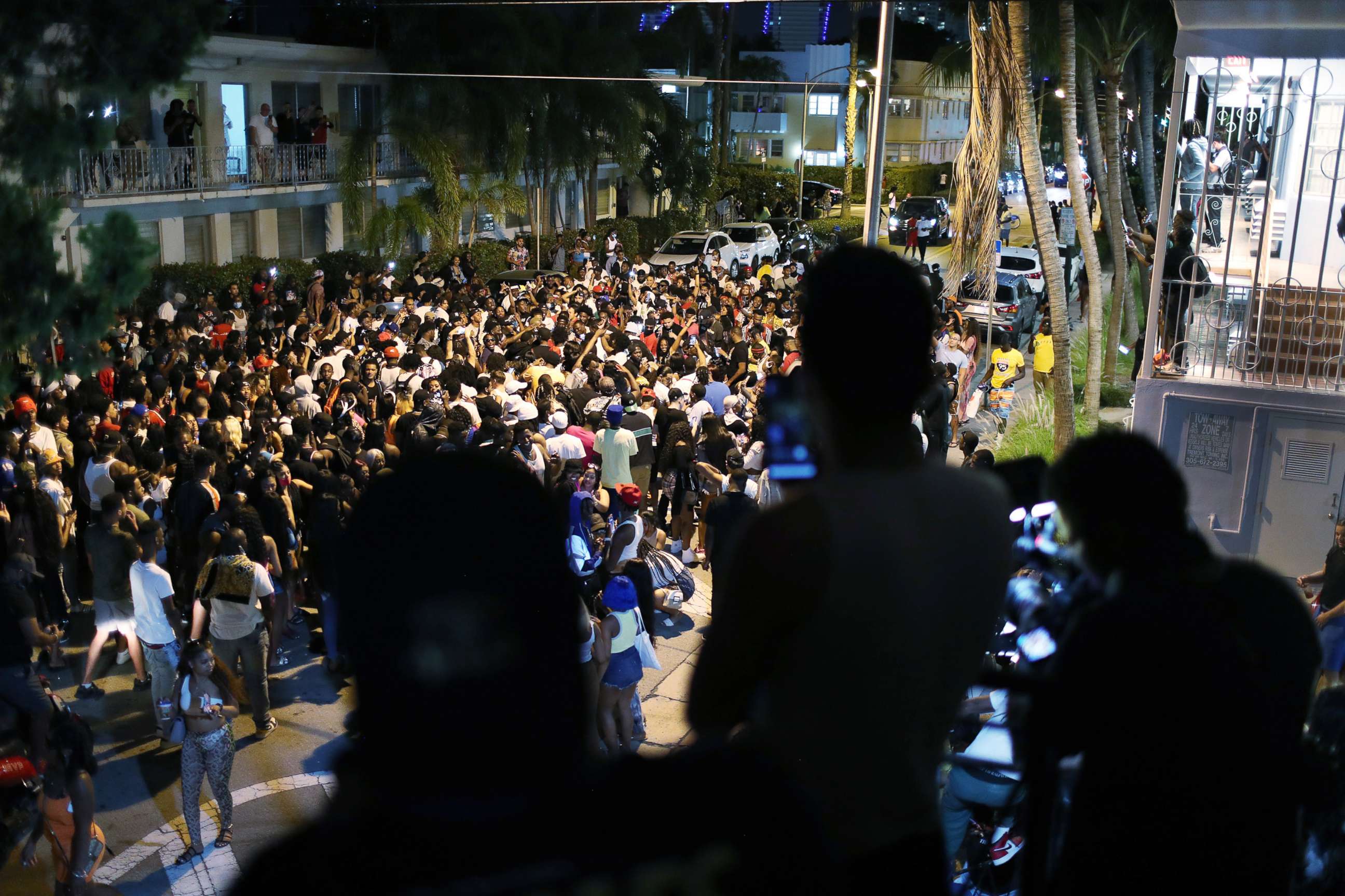 PHOTO: A crowd exits the area as an 8pm curfew goes into effect on March 21, 2021, in Miami Beach, Fla.