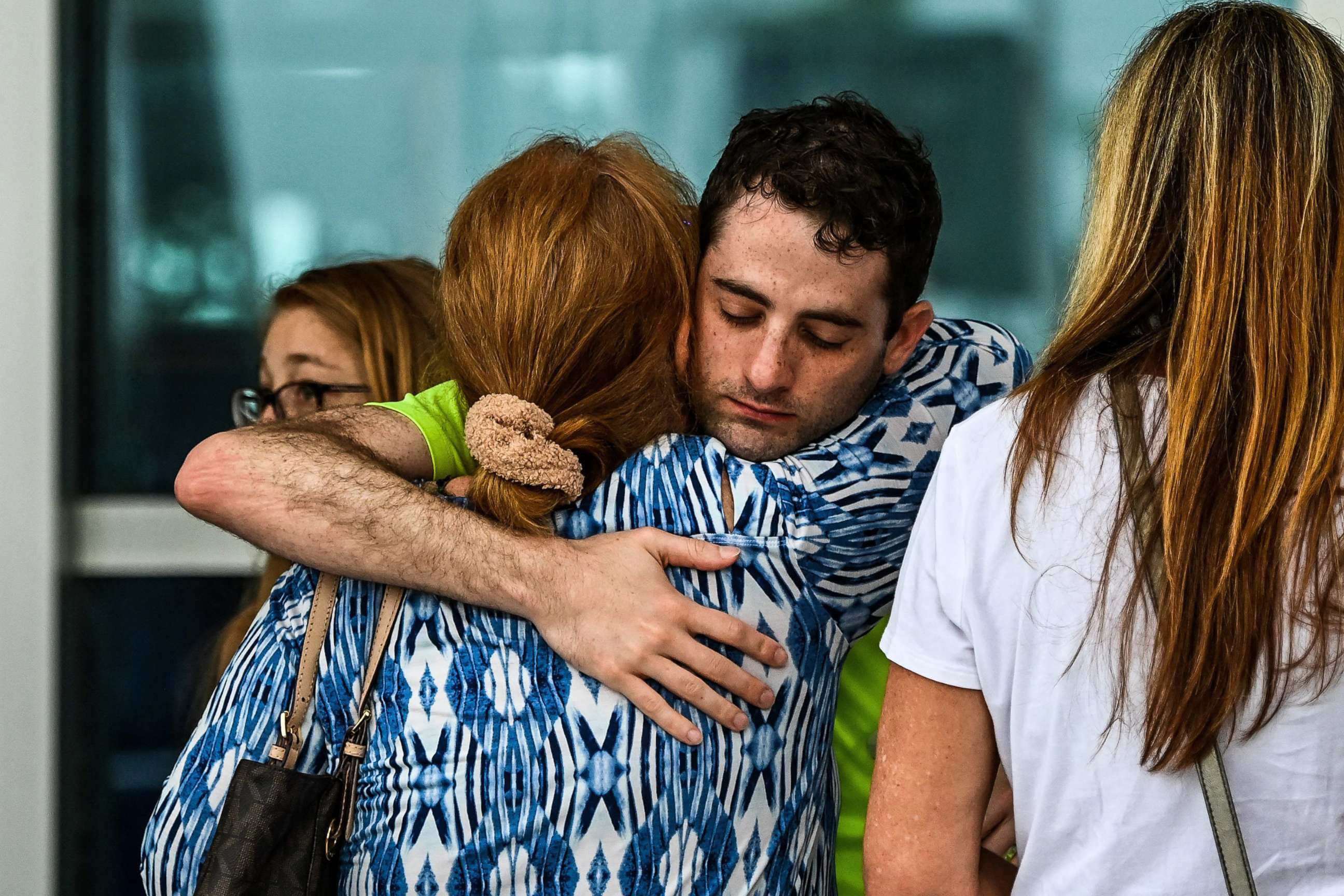 PHOTO: Family members and residents of the Champlain Towers South greet each other outside the Town of Surfside Community Center in Surfside, north of Miami Beach, on June 24, 2021.