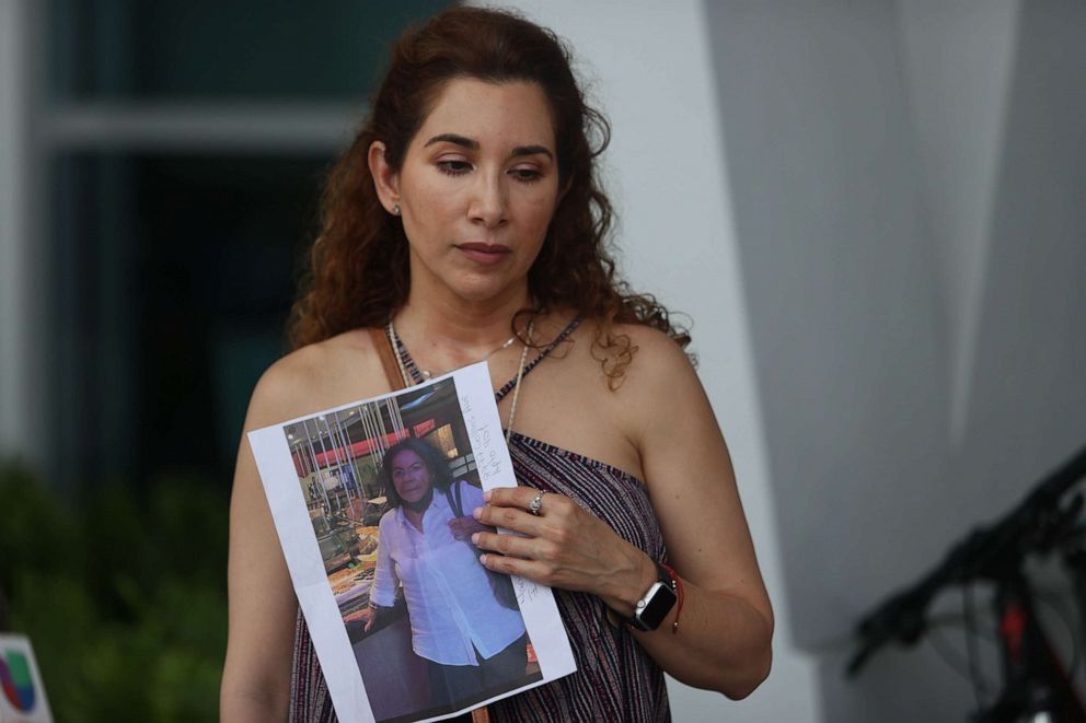 PHOTO: Luz Marina holds a picture of her aunt, Marina Azen, who she said is missing after the partial collapse of the 12-story Champlain Towers South condo tower that she was in on June 24, 2021 in Surfside, Fla.